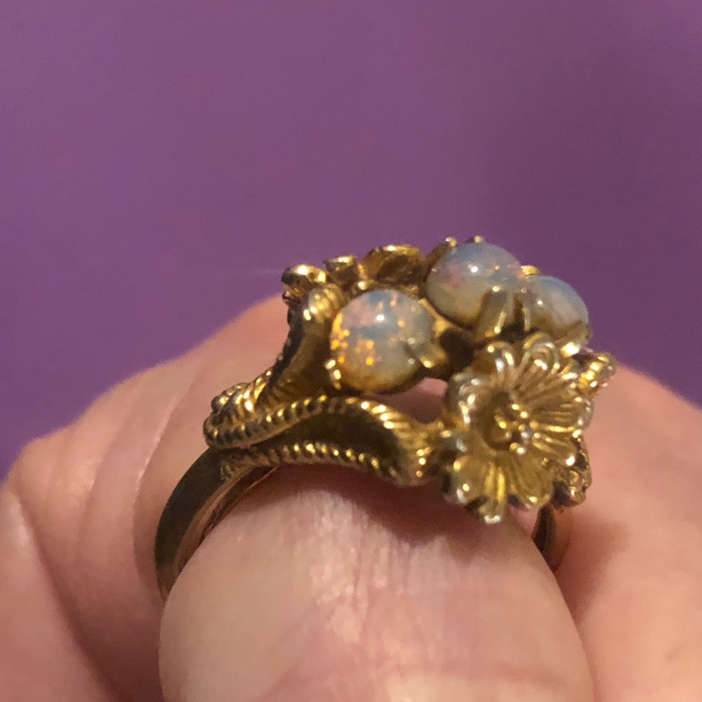 Avon Gold-toned adjustable Ring with opal colored stones and flower design